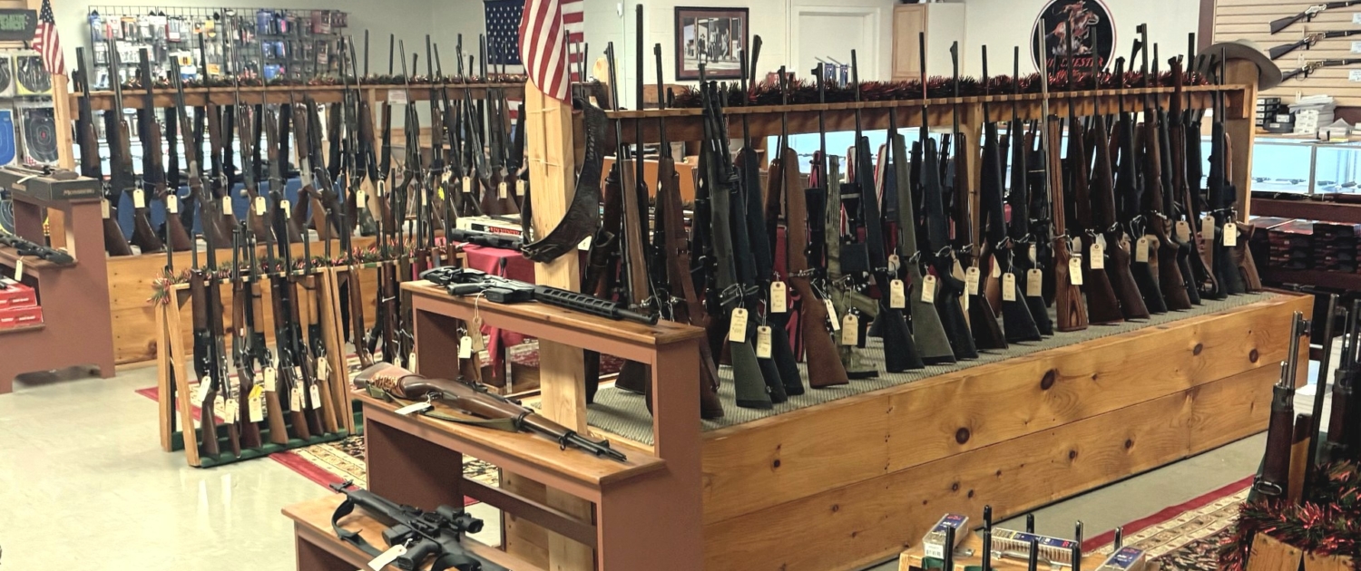 racks full of quality used guns at Tombstone Trading Company's Ware, MA showroom