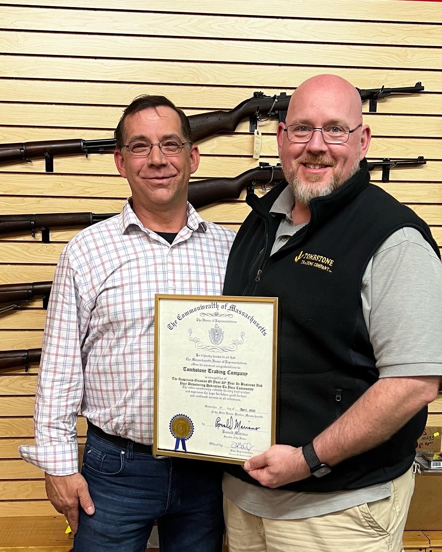 State Rep Donnie Berthiaume presents Jason Turcotte, Vice President of Operations for Tombstone Trading Company, Inc., a certificate recognizing the businesses' 20th year in business.