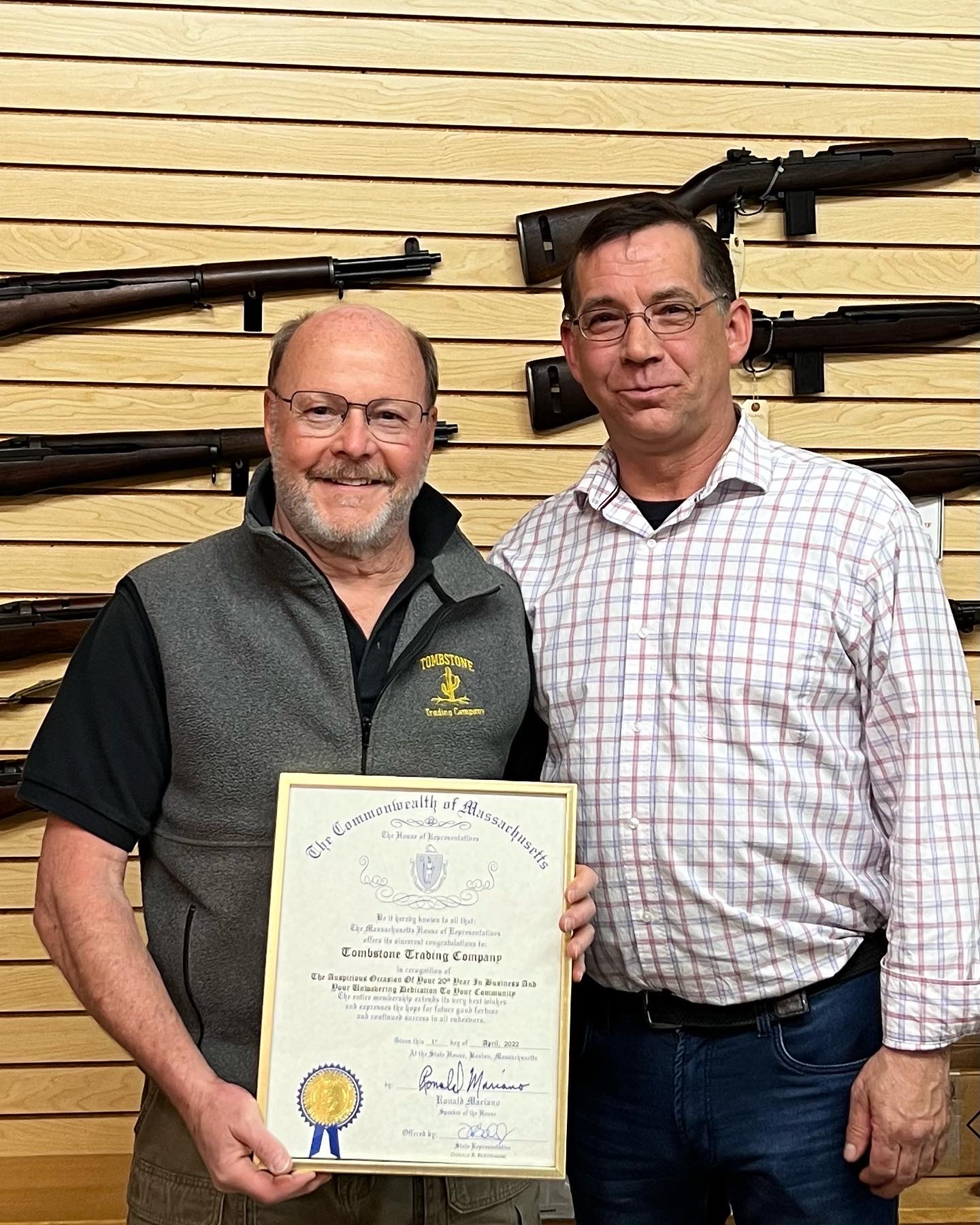 State Rep Donnie Berthiaume presents David P. Bourdeau, President of Tombstone Trading Company, Inc., a certificate recognizing the businesses' 20th year in business.